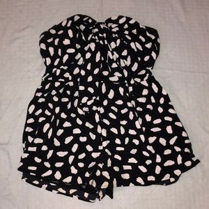 Black with white polka dots, romper by Blue Blush